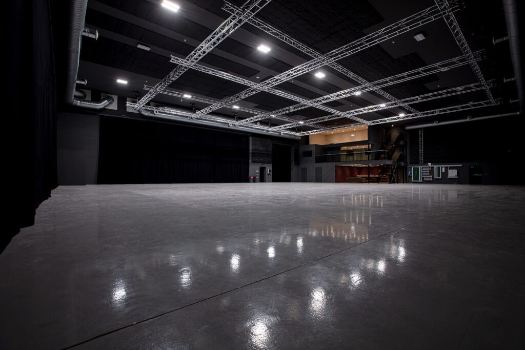 Interior of RD Studios sound stage with truss lighting and polished concrete floor