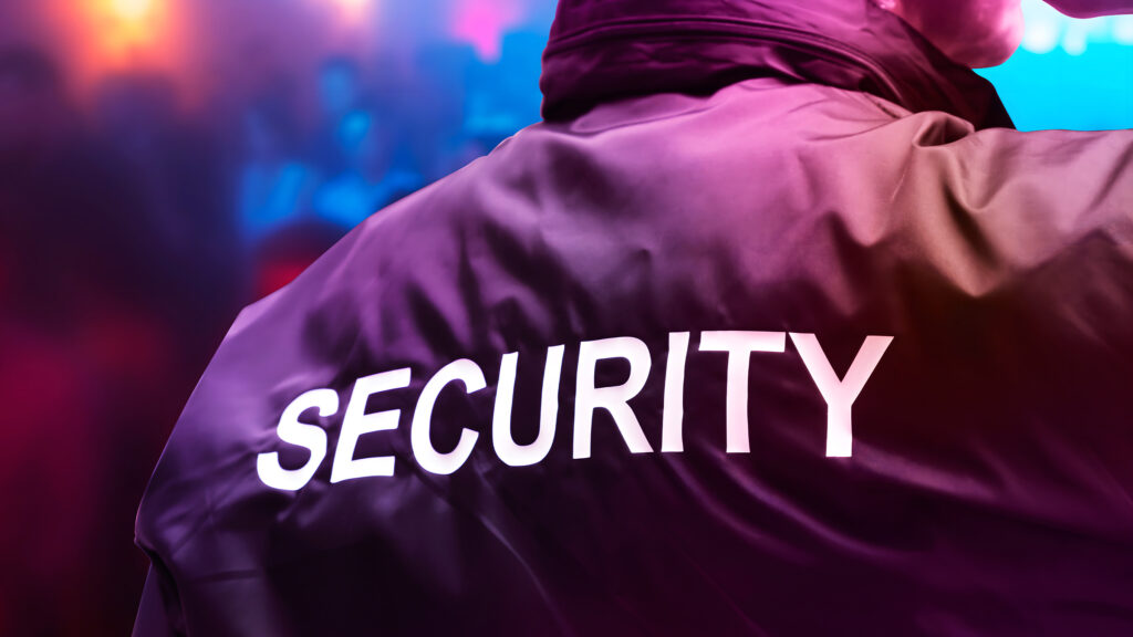 Security officer monitoring a busy public event.